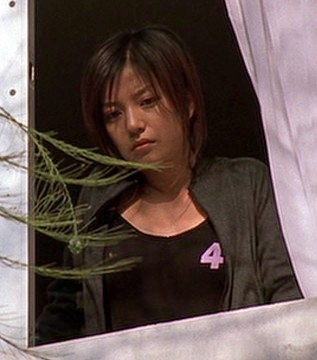 Sue looks out a window