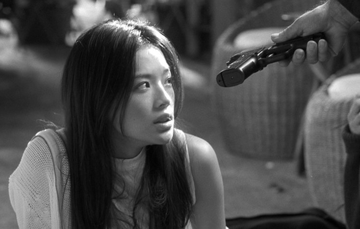 The killer hands Lynn a gun